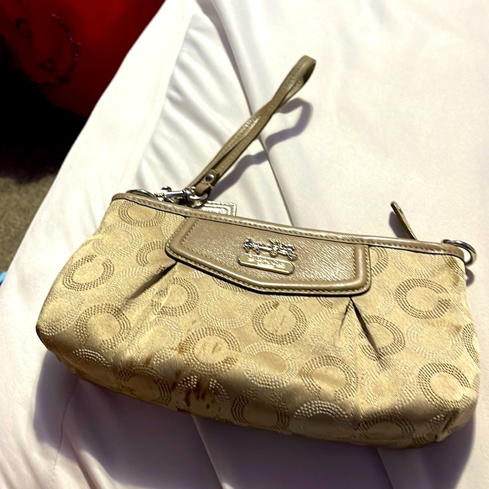 Cream colored monogrammed Coach wallet wristlet used a few times